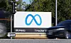 A car passes Facebook's new Meta logo on a sign at the company headquarters on Oct. 28, 2021, in Menlo Park, California.