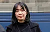 Han Kang stands outdoors in front of a building after receiving the Medicis Prize in Paris.