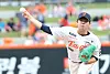 Hanwha Eagles pitcher in a white uniform throws a pitch on the mound during a baseball game.