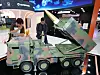 Visitors watch a mock-up of Chunmoo rocket launcher during an exhibition held in southern Seoul on June 18.
