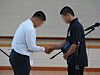 Student captains of Paichai High School and Gwangju Jeil High School shake their hands in Gwangjuon July 6.