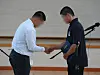 Student captains of Paichai High School and Gwangju Jeil High School shake their hands in Gwangjuon July 6.