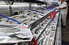 Rows of packaged Norwegian mackerel on ice in a Seoul supermarket seafood case.