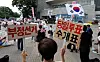 Protesters claim election fraud of the June 3 local elections during a rally in southern Seoul on July 5.