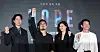 Four people pose onstage in front of a 'HOPE' backdrop at a film press event.