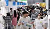 Visitors browse baby product at an exhibition held in western Seoul on June 11.