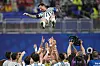 Argentina players toss teammate Lionel Messi into the air as they celebrate after the FIFA World Cup round of 16 soccer match between Argentina and Egypt in Atlanta, on July 7.