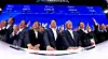 SK hynix executives and officials ring the opening bell on a Nasdaq stage in New York.