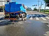 A truck sprays water to cool down temperatures on road in Pohang in North Gyeongsang on July 12.
