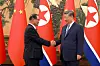 North Korean Premier Pak Thae-song, left, shakes hands with Chinese President Xi Jinping in Beijing, China, on July 11, in a photo carried by Rodong Sinmun.