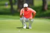 Tom Kim lines up a putt on the fifth green during the first round of the Charles Schwab Challenge golf tournament at Colonial Country Club in Fort Worth, Texas, on May 28.
