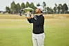 Tom Kim holds a trophy after winning Genesis Scottish Open held in Scotland on July 12.