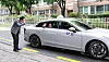 Seoul Mayor Oh Se-hoon, left, escorts an older adult who uses city-run taxi-ride request service for digitally marginalized population in western Seoul on July 6.