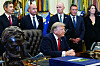 U.S. President Donald Trump, center, speaks at the White House in Washington on July 13.