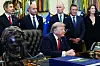 U.S. President Donald Trump, center, speaks at the White House in Washington on July 13.