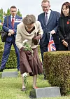 Princess Anne, the younger sister of British King Charles III, places a chrysanthemum on a grave of fallen British soldier M. Hogan at the United Nations Memorial Cemetery in Busan on July 14.