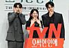 Three actors pose in front of a red tvN drama sign at a Seoul press event.