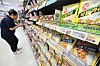 Shelves stocked with Ottogi food products in a Seoul supermarket aisle.