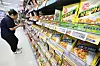 Shelves stocked with Ottogi food products in a Seoul supermarket aisle.