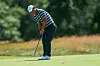 Tom Kim of Korea putts on the second green during the final round of the 126th U.S. Open at Shinnecock Hills Golf Club on June 21 in Southampton, New York.