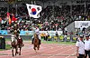 A horse-rider holds the Korean national flag at the Naadam Festival held in Ulaanbaatar in Mongolia on July 11.