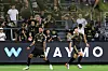 Son Heung-min of the Los Angeles FC, right, celebrates with Denis Bouanga after scoring a goal against the Real Salt Lake at BMO Stadium on July 22 in Los Angeles, California.