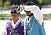 International tourists wearing Korean traditional attire are seen in a photo taken in Gyeongbok Palace in central Seoul on July 17.