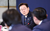 President Lee Jae Myung listens as participants of a tech-related gathering speak in San Francisco on July 25.