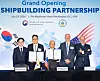 Korean Industry Minister Kim Jung-Kwan, far left, and U.S. Secretary of Commerce Howard Lutnick, far right, and officials from HD Hyundai Samho and HMM pose for a photograph in an event to celebrate opening of shipbuilding partnership between Seoul and Washington on July 23 in Washington D.C.