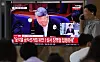 A television screen installed at Seoul Station in central Seoul shows a live broadcast of Yoon's first instance ruling of his election law violation case on July 27.