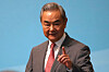Chinese Foreign Minister Wang Yi reacts upon arriving at the High-level Meeting on the Global Development Initiative in Beijing, China, on July 28.