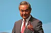 Chinese Foreign Minister Wang Yi reacts upon arriving at the High-level Meeting on the Global Development Initiative in Beijing, China, on July 28.