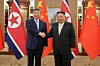 Chinese President Xi Jinping, left, and North Korean leader Kim Jong-un shake hands during their summit held in Pyongyang, North Korea, on June 8.