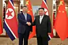 Chinese President Xi Jinping, left, and North Korean leader Kim Jong-un shake hands during their summit held in Pyongyang, North Korea, on June 8.