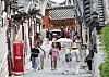 Foreign tourists are seen in Bukchon Hanok village in central Seoul on July 28.