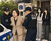 A generative AI-created image depicts a scene where stepmother is arrested by police officers in front of two female siblings.