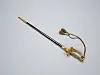 Ceremonial sword with gold details and a looped cord on a light gray surface.