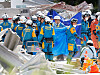 Rescue workers conduct a search operation at the damaged Aeon shopping Mall after an earthquake with a magnitude of 7.1 struck Kumamoto Prefecture, Japan, on July 30.