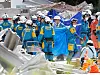 Rescue workers conduct a search operation at the damaged Aeon shopping Mall after an earthquake with a magnitude of 7.1 struck Kumamoto Prefecture, Japan, on July 30.