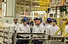 Hyundai Motor Group Executive Chair Euisun Chung, center in front row, inspects the automaker's factory in Sao Paulo in Brazil on July 27.