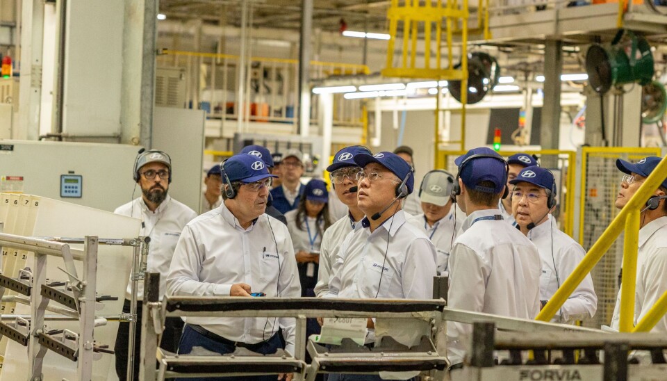 Hyundai Motor Group Executive Chair Euisun Chung, center in front row, inspects the automaker's factory in Sao Paulo in Brazil on July 27.