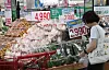 A consumer shops in a supermarket in Seoul on July 2.