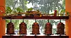 Decorative lanterns arranged on a stall with trees visible behind them.