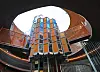 Cylindrical tower with orange panels beneath a large circular skylight at The Sanmaroo Playground.