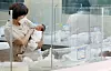A nurse takes care of a newborn baby at a medical facility in Seoul on Aug. 3.