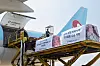 Korean Air cargo pallets of bottled water are loaded onto a KE557 freight aircraft for earthquake relief in Japan.