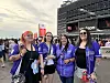 BTS fans pose for a photograph in front of MetLife Stadium in New Jersey, New York, on Aug.1.
