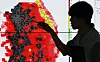 A weather forecaster points the greater Seoul area placed under the emergency heat wave warning at the Seoul Metropolitan Office of Meteorology in Gyeonggi on Aug. 4.
