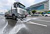 A water truck sprays water to cool down traffic road in central Seoul on Aug. 4.