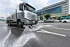 A water truck sprays water to cool down traffic road in central Seoul on Aug. 4.